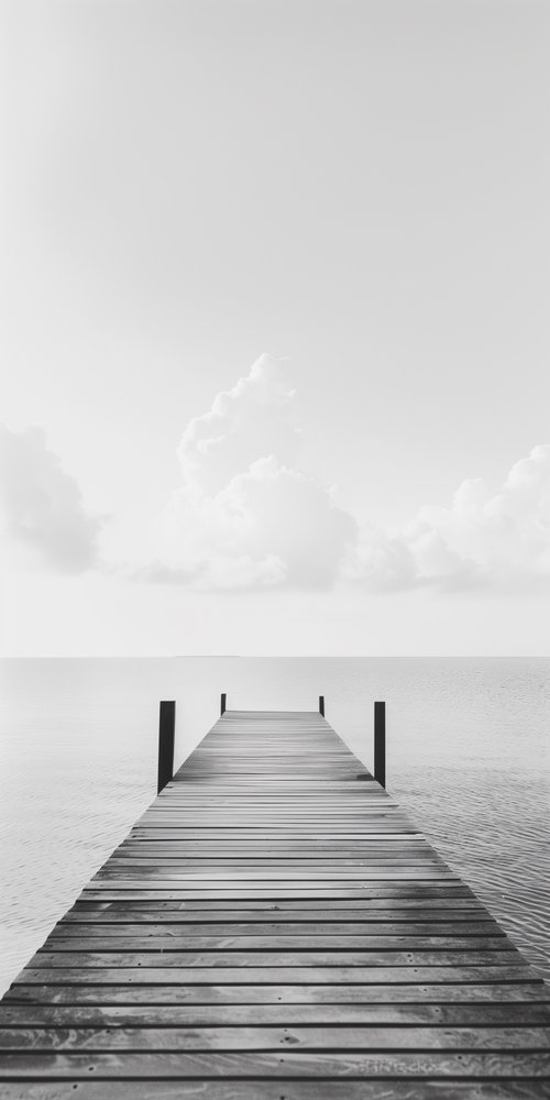 Dock extending into calm water wallpaper