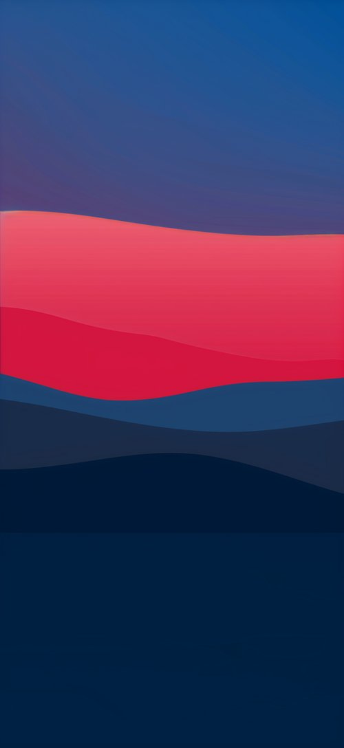A red and blue sunset with mountains in the background