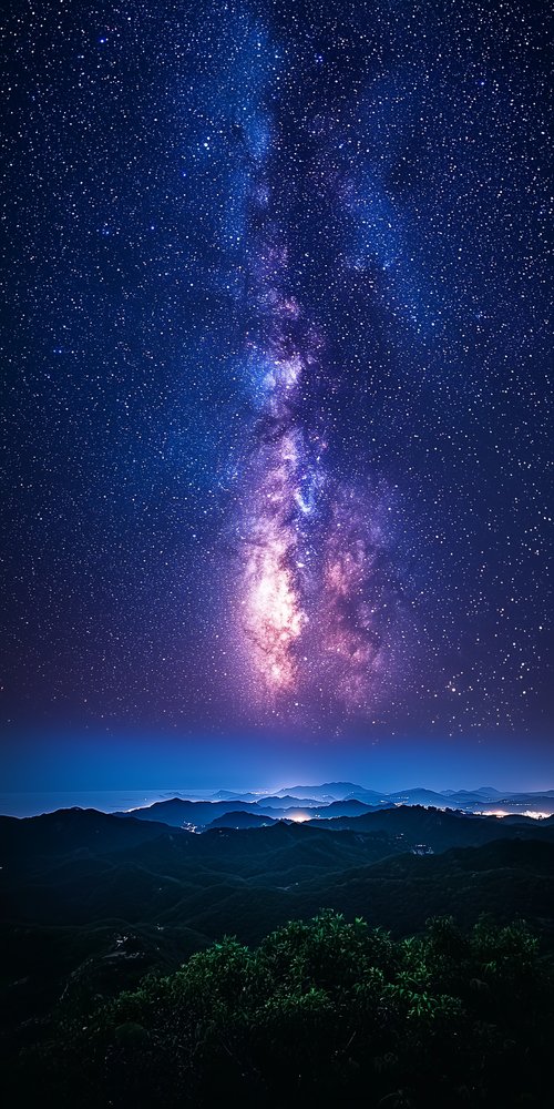 Starry sky over mountains wallpaper