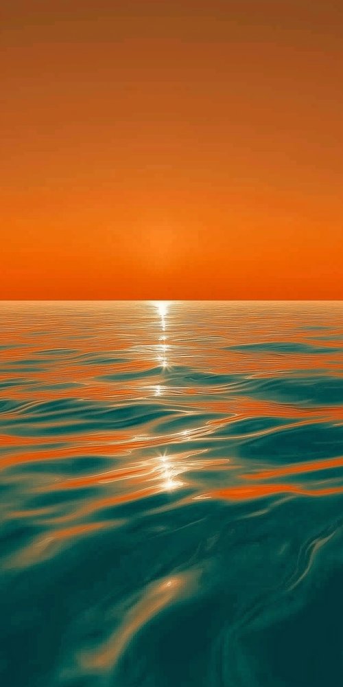 A sunset over the ocean wallpaper
