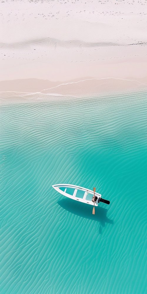 Boat on clear turquoise water wallpaper