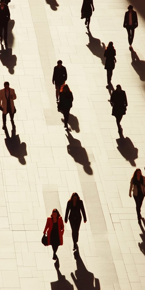 A group of people walking down a sidewalk wallpaper