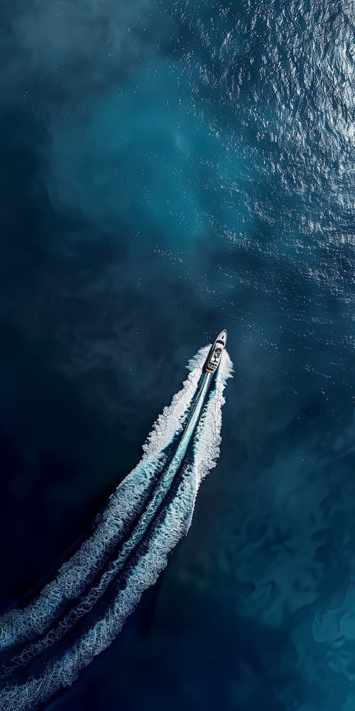 Boat on blue ocean wallpaper