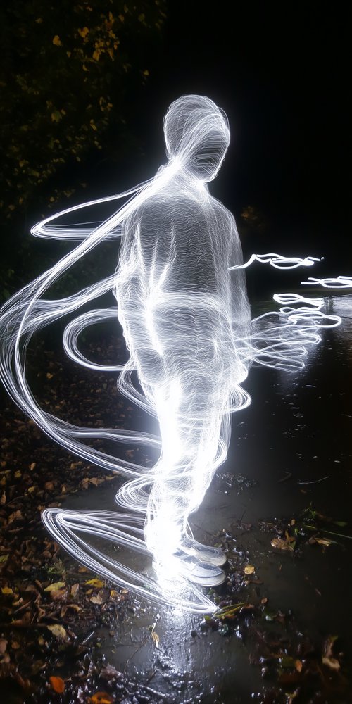 Person outlined with light trails wallpaper