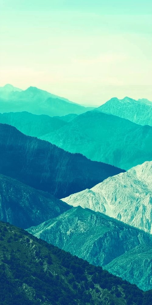 Layered mountain landscape teal hues wallpaper