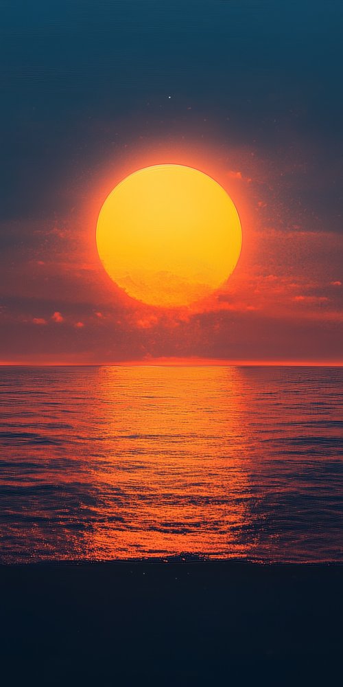 Sunset over ocean horizon wallpaper
