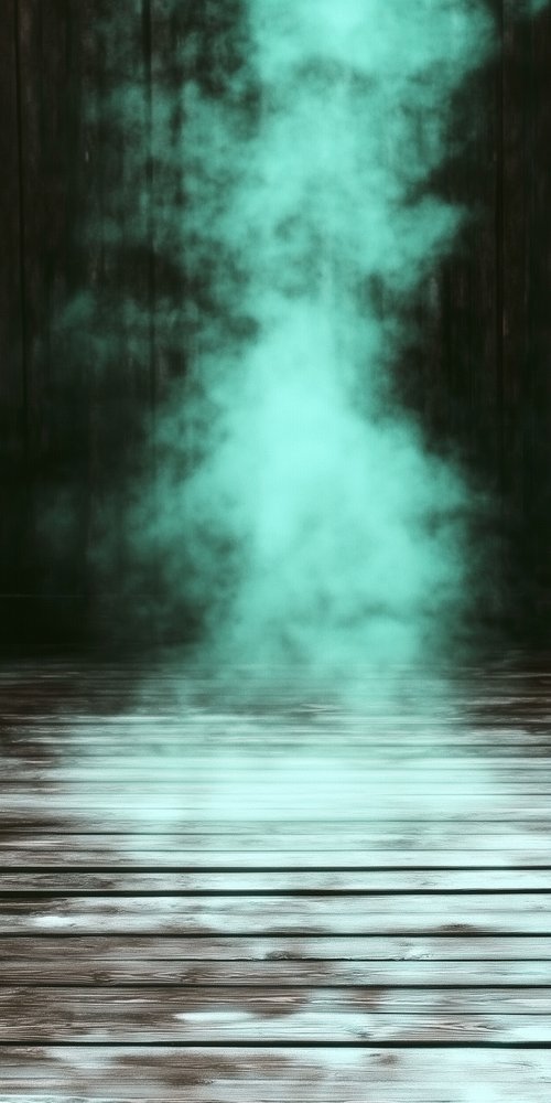 A dark forest with a fog in the middle wallpaper