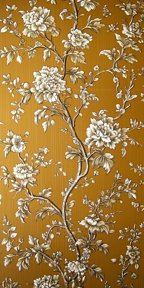 A wall with a floral pattern on it wallpaper
